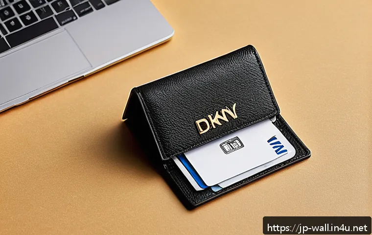 DKNY 모노그램 카드지갑 리뷰 - A sleek, compact DKNY monogram card case displayed on a modern wooden desk, featuring high-quality s...